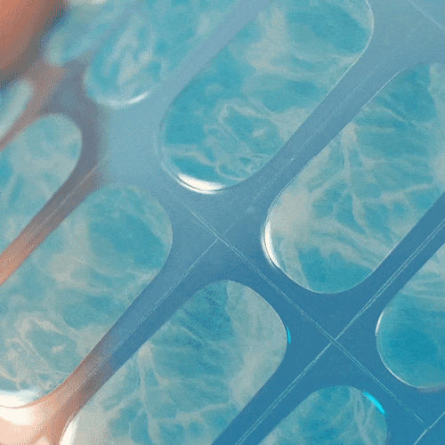 pool wave manicure using water resistant gel polish stickers for holiday