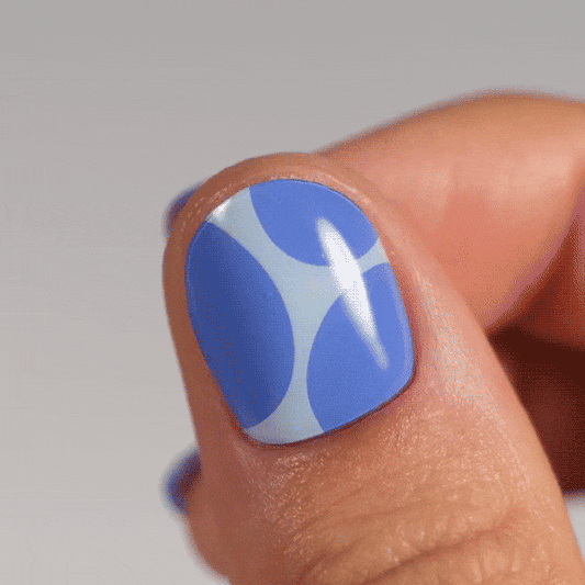 blue and light blue manicure made from real polish stickers on thumb