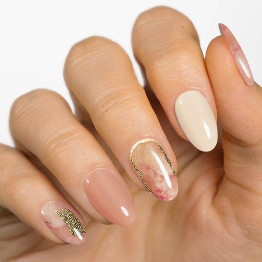 Lost Marbles patterned gel nail strip on hand — polka dot nail art inspiration by MoYou London