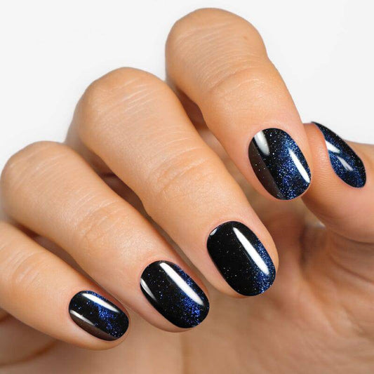 Cat eye nail design with magnetic swirl effect in deep blue — Galaxy Shine gel nail strips by MoYou London