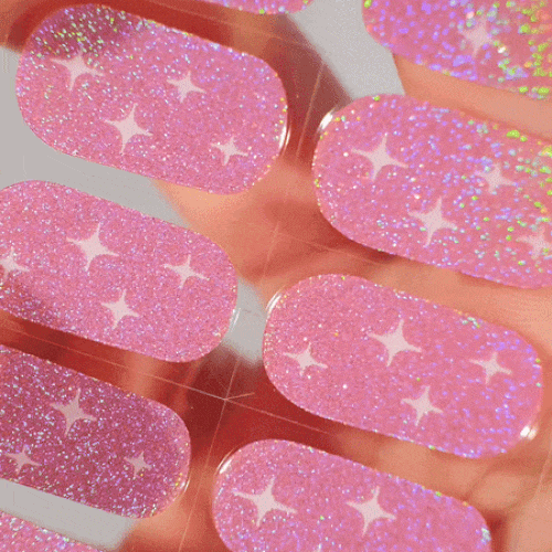 Colourful gel nail strips manicured being cured under UV/LED lamp