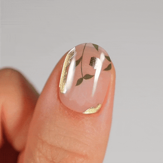 Colourful gel nail strips manicured being cured under UV/LED lamp