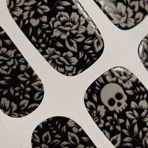 tattoo style halloween manicure using gel polish stockers with flower and sculls 