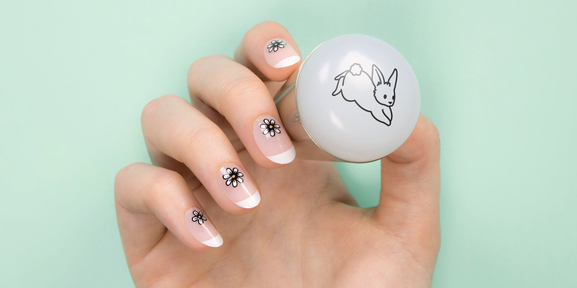 Floral easter nail art manicure with rabbit on stamp