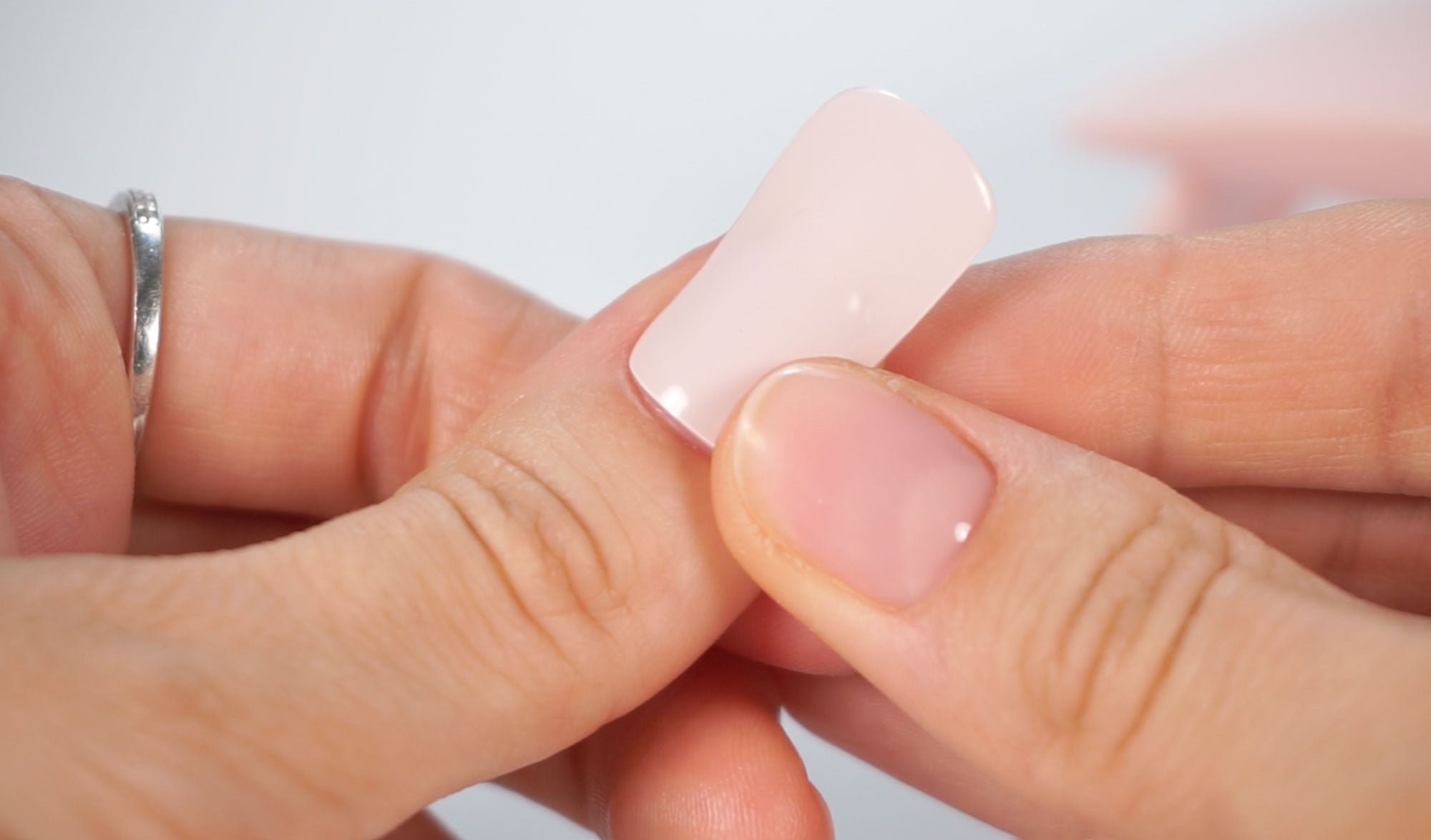 Sticking MoYou London Gel Nail Strip to the nail