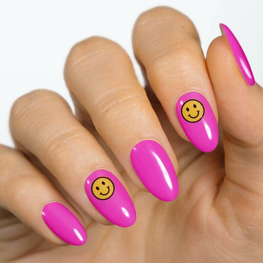 Gel Strip with smily emoji on top of pink polish by moyou London 