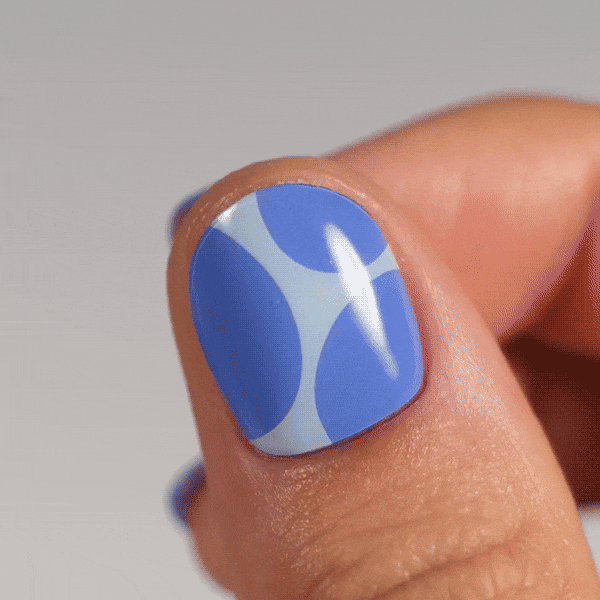 blue and light blue manicure made from real polish stickers on thumb
