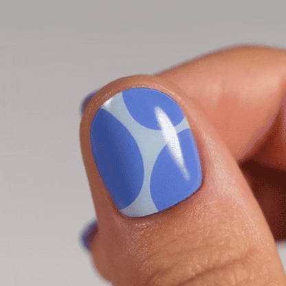 blue and light blue manicure made from real polish stickers on thumb