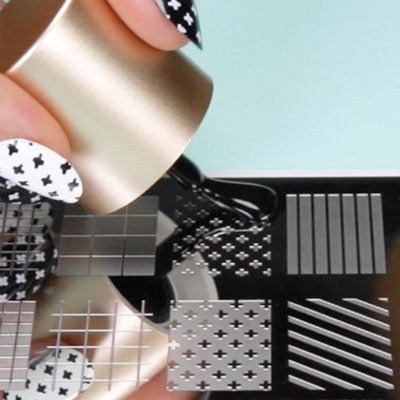 Nail polish being applied onto a nail stamping plate