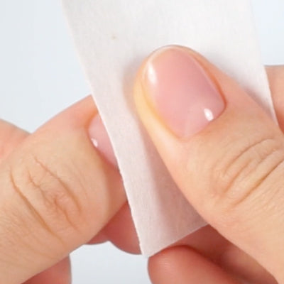 Cleaning the nail with a wipe