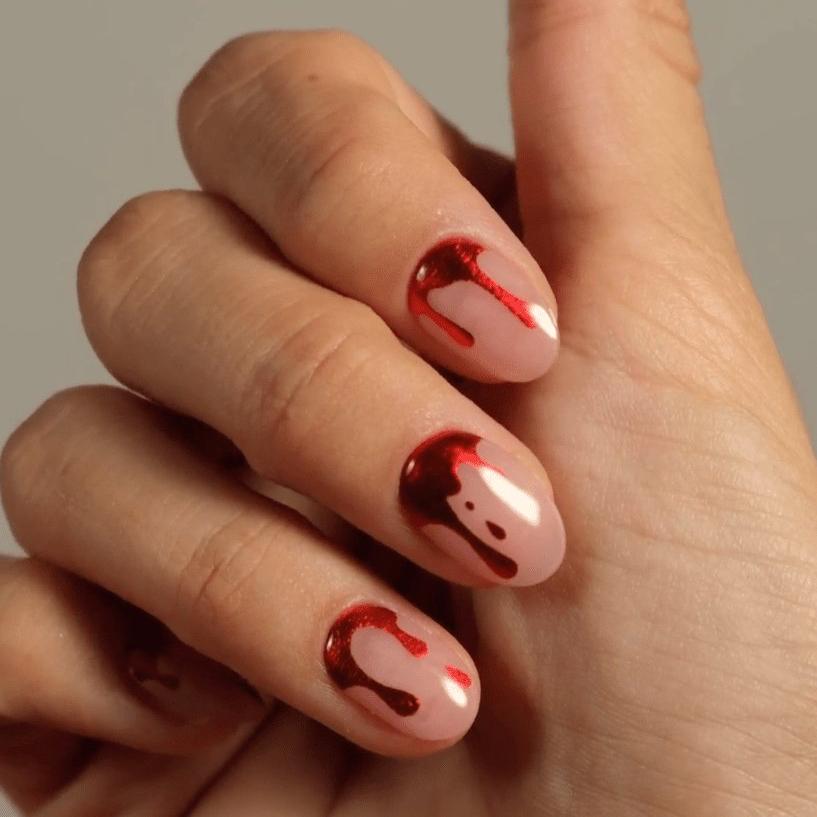 Halloween manicure with blood on a gel sticker made from gel polish