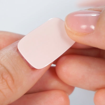 Carefully placing MoYou London Gel Nail Strip on top of the nail