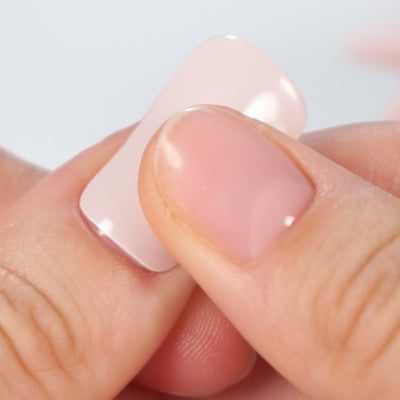Smoothing MoYou London's Gel Nail Strip surface onto the nail