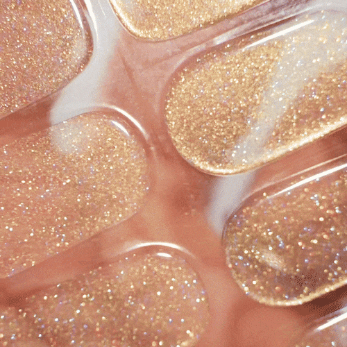 gold glittery manicure using gel polish stickers for glow and sparkle healthy nails