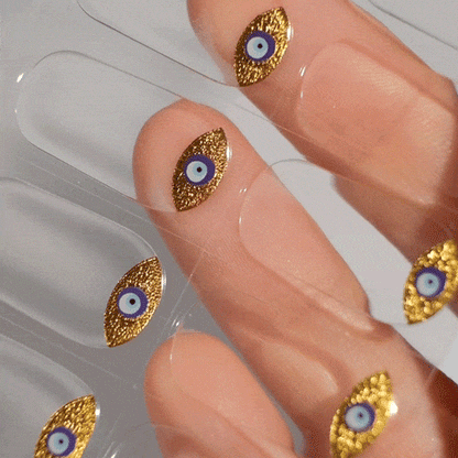 eye manicure design with blue and gold gel polish stickers made from gel polish