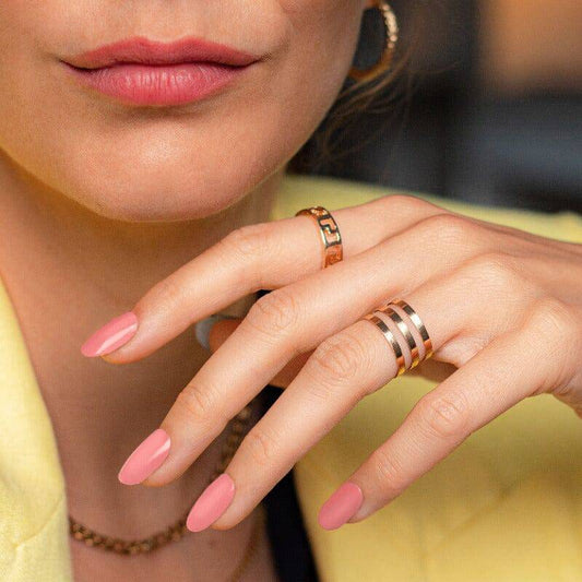 Natural pink nails styled with gold jewelry